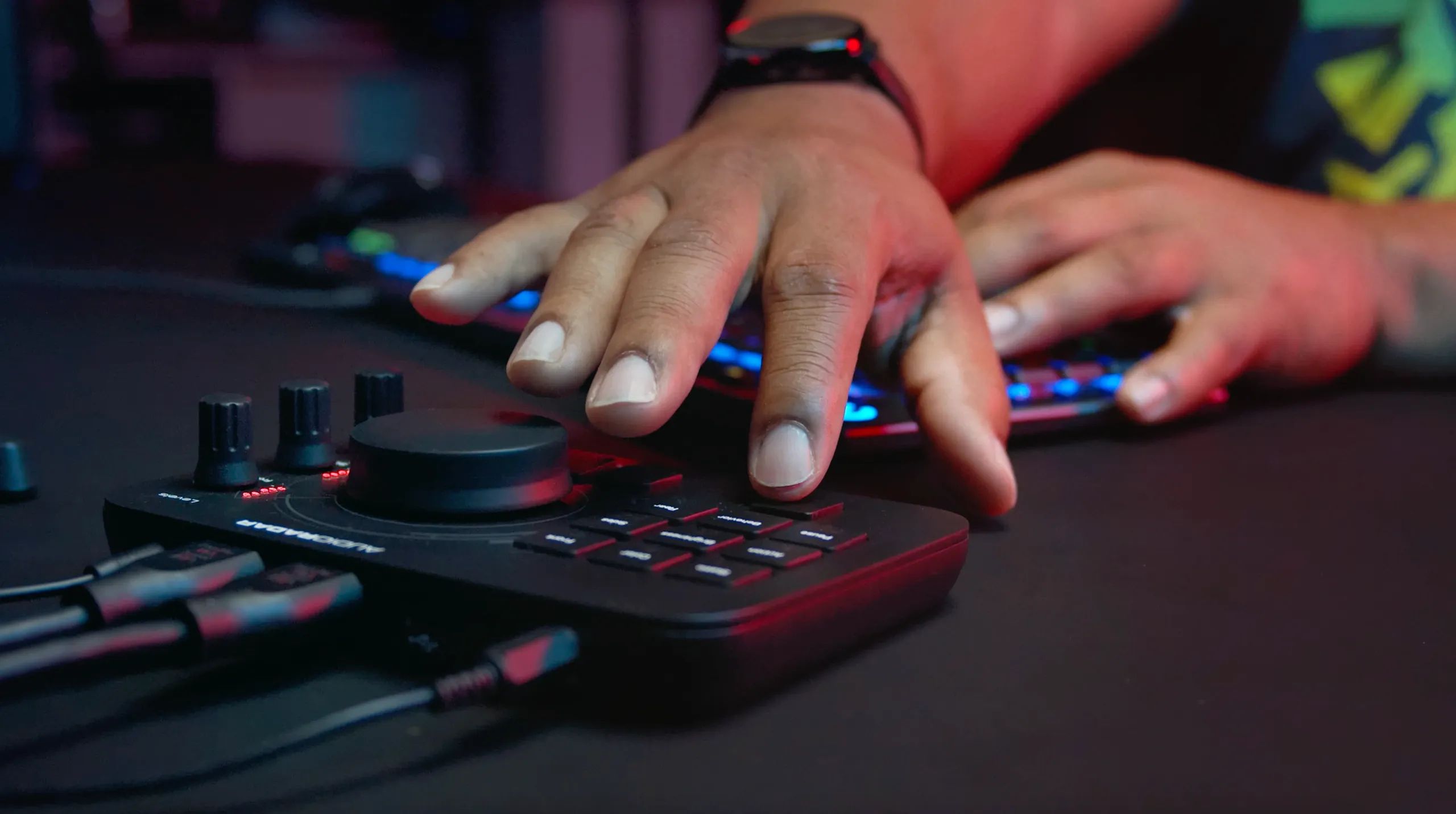 Person pressing button on Audio Radar gaming peripheral